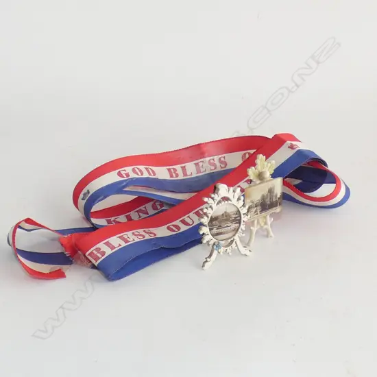 Two miniature sepia photographs on carved easels plus royal ribbon.